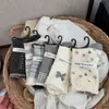 Estilo designer Songmu; meias com laço para mulheres, meias de cano médio, estilo coreano, design original de nicho, meias largas versão coreana para mulheres