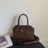 Bolso Vintage de Gamuza de Nicho 2026 Otoño/Invierno Nuevo Bolso Cruzado Versátil Bolso de Mano de Concha Moderno para Mujer