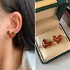 Pendientes de Botón Ovalados de Resina Transfronterizos Europeos y Americanos Pendientes Maillard de Otoño e Invierno Pendientes Simples de Moda Versátiles para Mujer Sensación de Alta Gama
