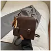 Mochila Contrastante Estilo Coreano Moda Retrô Feminina 2025 Outono Nova Moda Bolsa de Mão Mochila de Viagem Bolsa Transversal