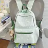 Nuevo modelo 2026 mochila casual estampada estilo ins para estudiantes de secundaria y primaria, mochila ligera de gran capacidad para ir a la escuela para niñas