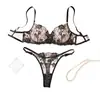 Conjunto de lencería europeo y americano de estilo transfronterizo con encaje negro bordado, que incluye un tanga sexy transparente y un conjunto de dos piezas, disponible para venta al por mayor