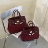 Bolso de mano vintage de platino de alta gama para mujer, nuevo modelo 2026, moderno y versátil para ir al trabajo, bolso de hombro y cruzado, comercio exterior