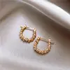 Pendientes de Flor de Molino de Viento Metálico Círculo Pendientes para Mujer Celebridad de Internet Pendientes Elegantes de Viento Frío Pendientes Retro Simples Distintivos de Guisantes Dorados
