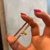 Popular Pulsera de Cuerda Trenzada Roja de Doble Hilo con Pequeño Colgante de Despertar del León de Xiaohongshu Diseño Otoño e Invierno Navidad Joyería de Mano Envío Directo