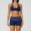 Nuevo conjunto de yoga de lunares Zechuang con tirante halter, diseño de dos piezas falso, conjunto deportivo de secado rápido para correr y fitness 4549