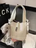 Bolso Cubo de Nicho Estilo Coreano para Mujer Nuevo Modelo 2026 con Acabado de Alta Gama, Bolso de Mano Sencillo con Patrón de Lichi, Bolso de Hombro y Cruzado de Lujo Ligero