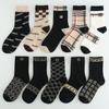 Meias leves de luxo masculinas de cano médio outono e inverno maré marca Joker alto valor de cor rufião bonito estudantes desodorante preto meias longas de algodão atacado