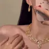 Estilo Europeu e Americano Indústria Pesada Luxo Leve Estilo Socialite Cor Champanhe Conjunto de Brincos e Colar Corrente Elegante de Clavícula Alta Moda