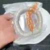 Se sostiene la pulsera de mano de intestino grueso de abanico de Xingyue, con un tamaño de aproximadamente 14 mm, accesorios DIY