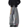 Jeans wide leg retrô americano com bordado de desenho animado, cinto xadrez, lavagem desgastada e corte reto até o chão para homens e mulheres