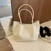 Bolso de mano tejido de diseño de nicho transfronterizo para mujer, nuevo estilo 2026, con temperamento, casual, gran capacidad, para el trabajo, de un solo hombro, para llevar debajo del brazo