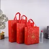 Bolsa de regalo de Año Nuevo, bolsa de regalo festiva de Año Nuevo, bolsa de mano de tela no tejida roja para cigarrillos, vino, té, bolsa para banquetes, hecha a medida