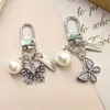 Nuevo de Moda Venta Caliente Transfronteriza Estilo Coreano Flor de Cinco Pétalos Niña Flor de Pera Colgante Llavero Accesorio Decoración para Bolsa Zouju