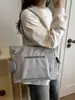 Nuevo bolso de lona para mujer de principios de otoño de 2026, bolso tote versátil para el trabajo, bolso de hombro de gran capacidad para la escuela, bolsos de mujer al por mayor