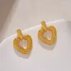 Pendientes Metálicos con Textura Cóncava-Convexa Creativa de Nicho Europeo y Americano con Forma de Corazón Pendientes Retro con Patrón de Martillo Pendientes con Forma de Durazno para Mujer