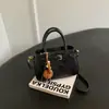 Bolso de diseño nicho para mujer, nuevo bolso de hombro Maillard de gamuza para otoño e invierno 2026, bolso cruzado coreano ins