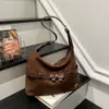 Moda de moda Versátil Gran capacidad Bolso de hombro Bolsos de alta gama Bolso de mano para el trabajo Bolso cruzado único de nicho elegante