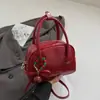 Bolsa Almofada Feminina 2025 Outono Nova Bolsa Pequena de Mão com Aparência Sofisticada Bolsa de Ombro Transversal da Moda