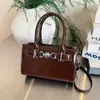 Bolsa de Mão Elegante Feminina 2025 Inverno Novo Estilo Transfronteiriça, Bolsa de Ombro Versátil com Textura de Alta Qualidade, Bolsa Transversal Casual com Toque Premium