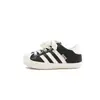 Zapatillas casuales para niños 2026 otoño e invierno de moda versátiles nuevas con estampado de leopardo puntera de concha para niños zapatillas resistentes a la suciedad para niñas