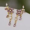 2024 nueva moda atmósfera moda púrpura anillo de diamantes completo aretes versátiles personalidad diseño nicho aretes exquisitos