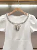 Vestido de Verano Nuevo Estilo Francés Elegante con Pedrería y Lentejuelas y Lazo de Manga Corta para Mujer de Ropa Fina Nanyou Shenzhen