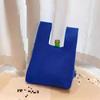 Bolso de mano de punto hueco nuevo para primavera y verano, bolsa de compras abierta simple fresca transfronteriza, bolsa de playa, bolsa ligera para el día a día