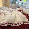 Juego de cuatro piezas estilo princesa de algodón lavado jacquard teñido en hilo con bordado, funda nórdica floral estilo ins fresca y delicada, juego de tres piezas