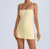 Mono de yoga transfronterizo para mujer, diseño de bloques de color con copas incorporadas en el pecho, falda de tenis con forro anti-exposición, vestido tipo tank top deportivo para fitness