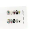 Puntas de uñas cortas de alta gama hechas a mano y de colores con lindos pedrería en forma de corazón europeos y americanos, parches de uñas postizas brillantes