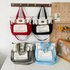 Bolsa de maquillaje de gran capacidad 2024 primavera costura de color contrastante bolso tote mochila de viaje femenina bolso de mano simple para el trabajo