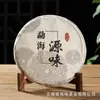 Atacado Armazém seco de chá Pu'er chá cozido Sabor da origem Menghai Bolo de sete sementes Yunnan chá cozido 357g