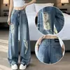 Jeans curvos rotos de cintura baja estilo americano para mujer, versión fina de verano 2026, súper populares de corte holgado, pantalones de pierna ancha desgastados que favorecen la figura