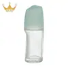 Fábrica en stock al por mayor nuevo frasco de bola rodante 50ml frasco de bola para caminar loción corporal antitranspirante frasco de vidrio tapa de granos de masaje