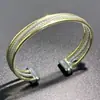 Pulseira de Cabo Torcido em Aço Inoxidável David, Design Único de Luxo de Alto Padrão, Pulseira Aberta, Disponível Exclusivamente na Amazon