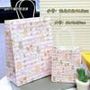 Bolsa de papel kraft de alto valor de color ins manzana gato negro pequeño linda bolsa de embalaje para regalo caricatura exquisita bolsa de mano venta al por mayor