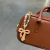 Llavero de arco de arcilla con diamantes completos, colgante de cadena de cuentas de cristal de moda, accesorio de bolso para chica dulce y genial, cadena para colgar el teléfono