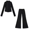 Fabricante mayorista de ropa para mujer transfronteriza 2026 cárdigan térmico de ajuste slim con cuello alto y cremallera y conjunto de pantalones de microcampana hasta el suelo