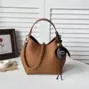 Bolsa de mão com textura de tendência transfronteiriça, bolsa tipo balde, bolsa feminina, novo verão 2026, cor sólida, corrente, bolsa de ombro único, bolsa tiracolo mãe-filho