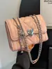 Bolso de cadena acolchado estilo Chanel para mujer, nuevo bolso cruzado mini de moda versátil 2026, bolso cuadrado pequeño popular