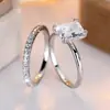 Bestseller Transfronterizo Rongxing: Anillo de compromiso de cuatro puntas con corte princesa en tono plateado, Accesorios de compromiso para banquetes, Anillos de pareja para propuesta de mujeres