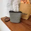 Bolso de Hombro Transfronterizo para Mujer 2026 Nuevo Diseño Bolso de Hombro Versátil Texturizado Bolso Cruzado de Cubo de Nicho Bolso de Playa