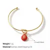 Moda Europea y Americana Estilo Minimalista Colorido Frijol de Caramelo de Imitación Colgante de 26 Letras Pulsera Nudada Joyería Versátil para Apilar