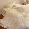 Estilo romántico francés femenino Tencel de algodón ultra suave con volantes y encaje color crema juego de ropa de cama casual de cuatro piezas