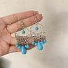 Pendientes colgantes de piedra de pino de estilo nacional retro bohemio europeo y americano transfronterizos, pendientes con borlas huecas, venta directa de fábrica