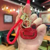 Llavero de rana con pedrería de arcilla más vendido de Amazon, lindo colgante de dibujos animados, accesorio de bolsa con diseño de nicho