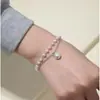 Pulsera de perlas de doble capa transfronteriza europea y americana para mujer, moda retro, diseño simple de personalidad, estilo frío, pulsera estilo Hong Kong