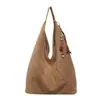 Bolsa de Hombro Individual de Gamuza Retro al por Mayor para Mujer 2026 Nueva Bolsa Tote Grande de Gran Capacidad con Borlas Estilo Coreano Versátil