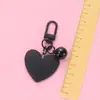 Nuevo llavero Bell love colgante lindo color resina corazón de durazno accesorios pequeño fresco adornos de corazón de durazno